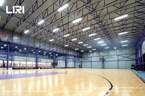 Electric retractable roof closing during rain over basketball court