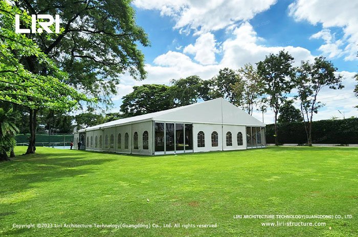 Weather resistant tent structure with sloped roof for snow and rain drainage Weather resistant tent structure with sloped roof for snow and rain drainage