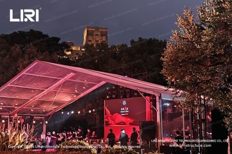 Clear tent blending with Bund architecture