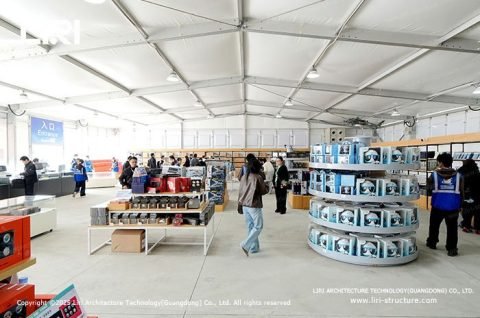 Flagship souvenir shop and service area housed in aluminum tents at AERO Asia