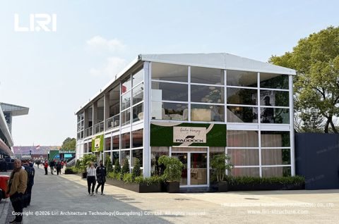 Two story tent F1 Paddock Club entrance-side exterior with Paddock entry door