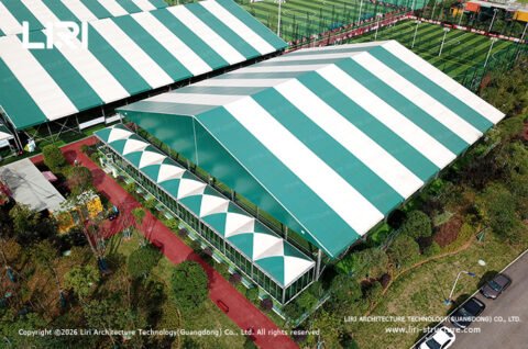 Green and white modular sports hall roof and facade