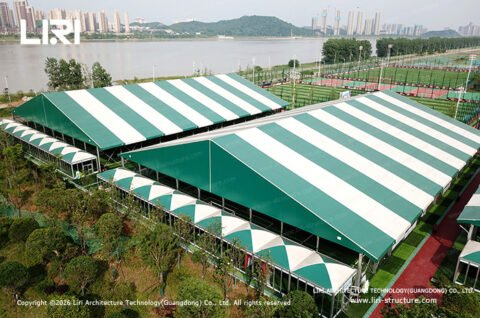 Modular sports hall exterior beside outdoor football fields