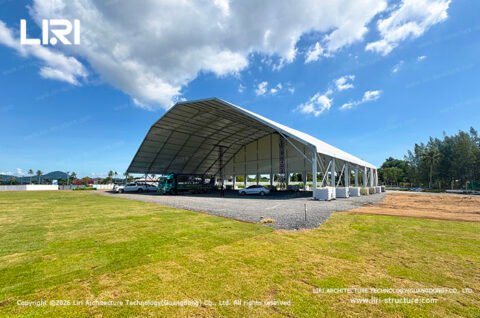 Open sided polygon top tent on a grass event site