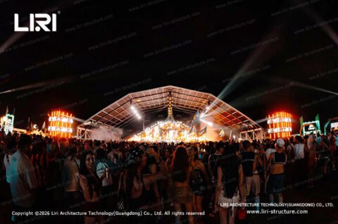 Outdoor celebration crowd under a polygon top tent
