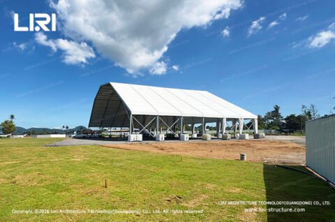 White polygon top tent exterior for an outdoor celebration space