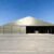 Camouflage modular aircraft hangar with a wide open entrance