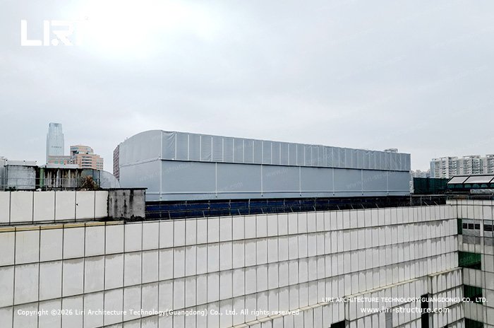 Enclosed rooftop retractable roof system for a pickleball court