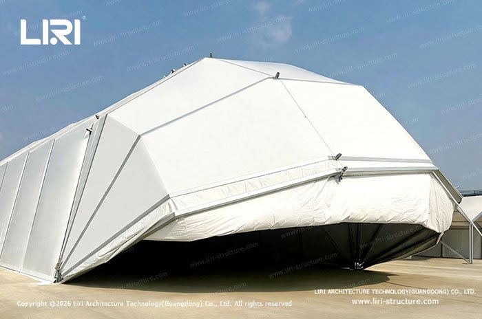 White clamshell modular aircraft hangar exterior with fully opening front