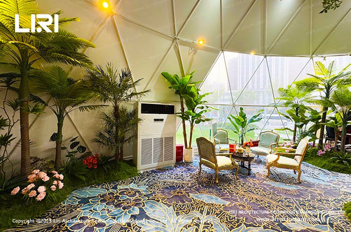 Climate-controlled seating area beside a panoramic geodesic dome window