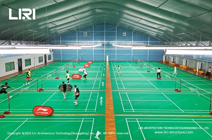 Multi-court badminton hall under a high insulated membrane roof
