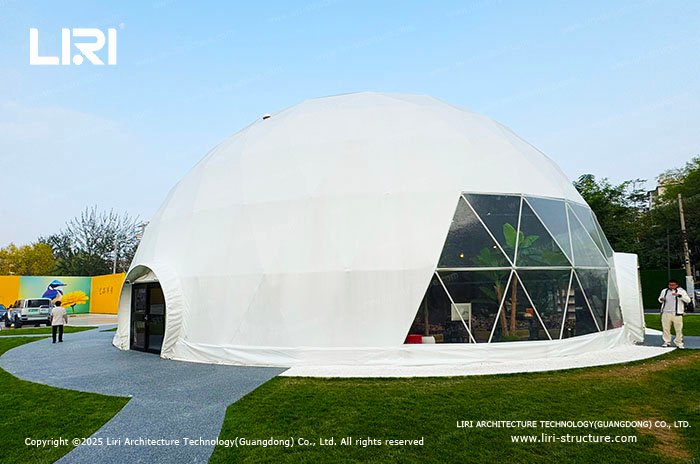 White geodesic dome tent with a panoramic window for a pop-up event
