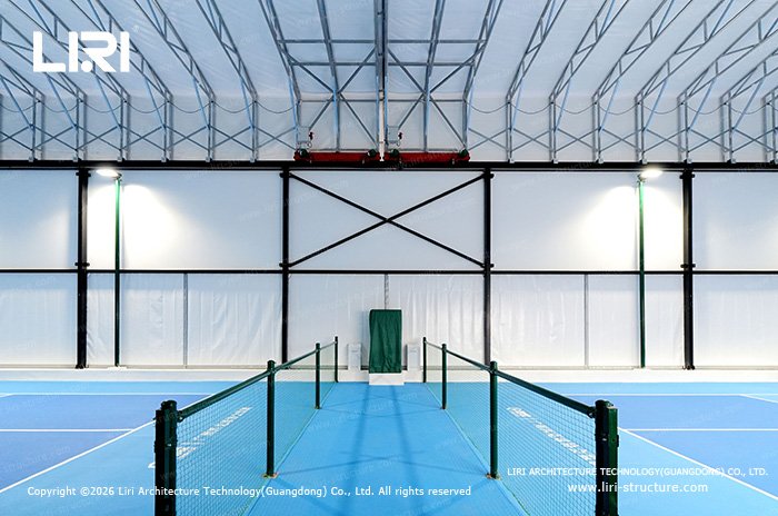 Roof frame, drive assembly and side structure above a blue pickleball court